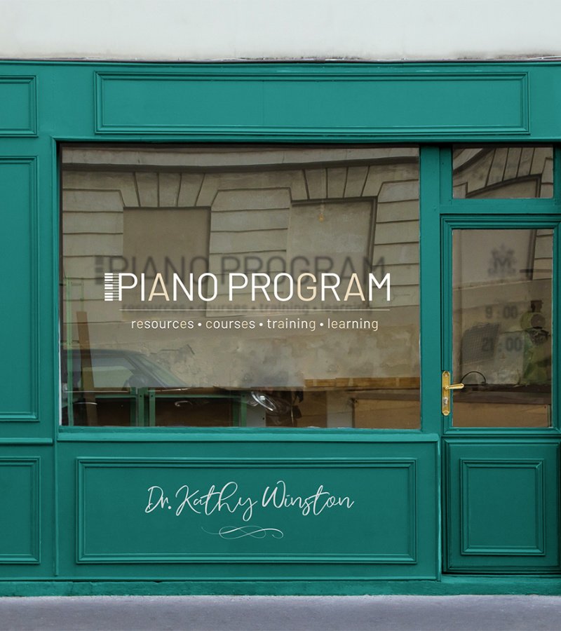 Vintage shop fassade painted in teal color with Piano Program logo across the window