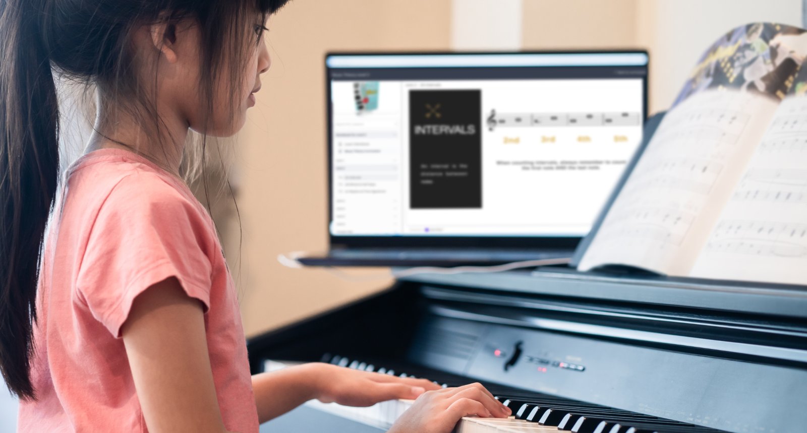 Young Asian girl sitting learning to play piano from an online course on her open laptop